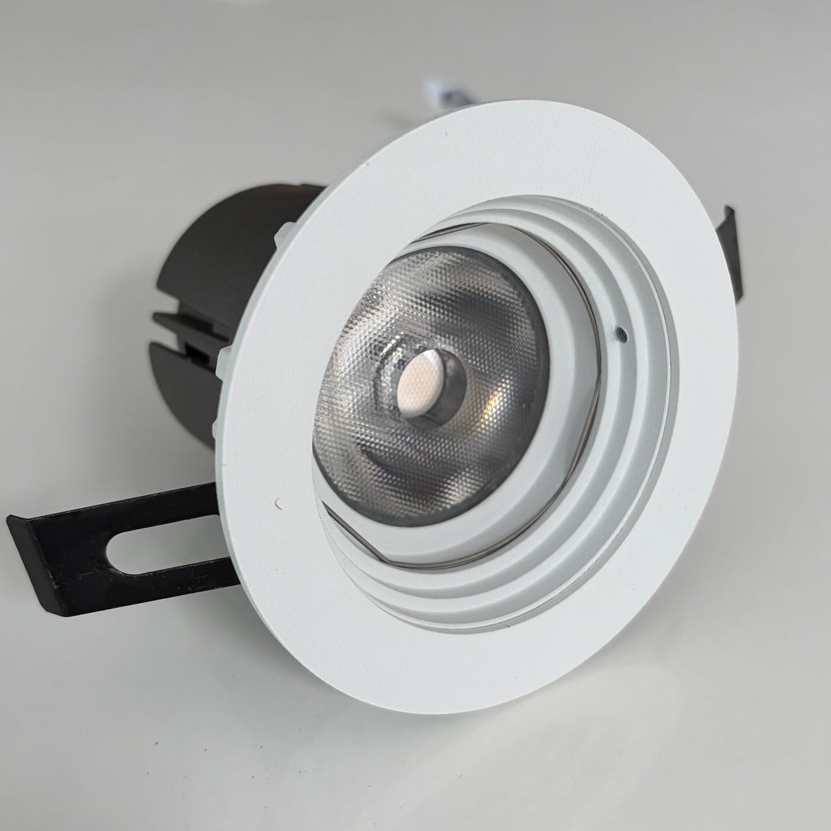 White recessed ceiling light on a gray background