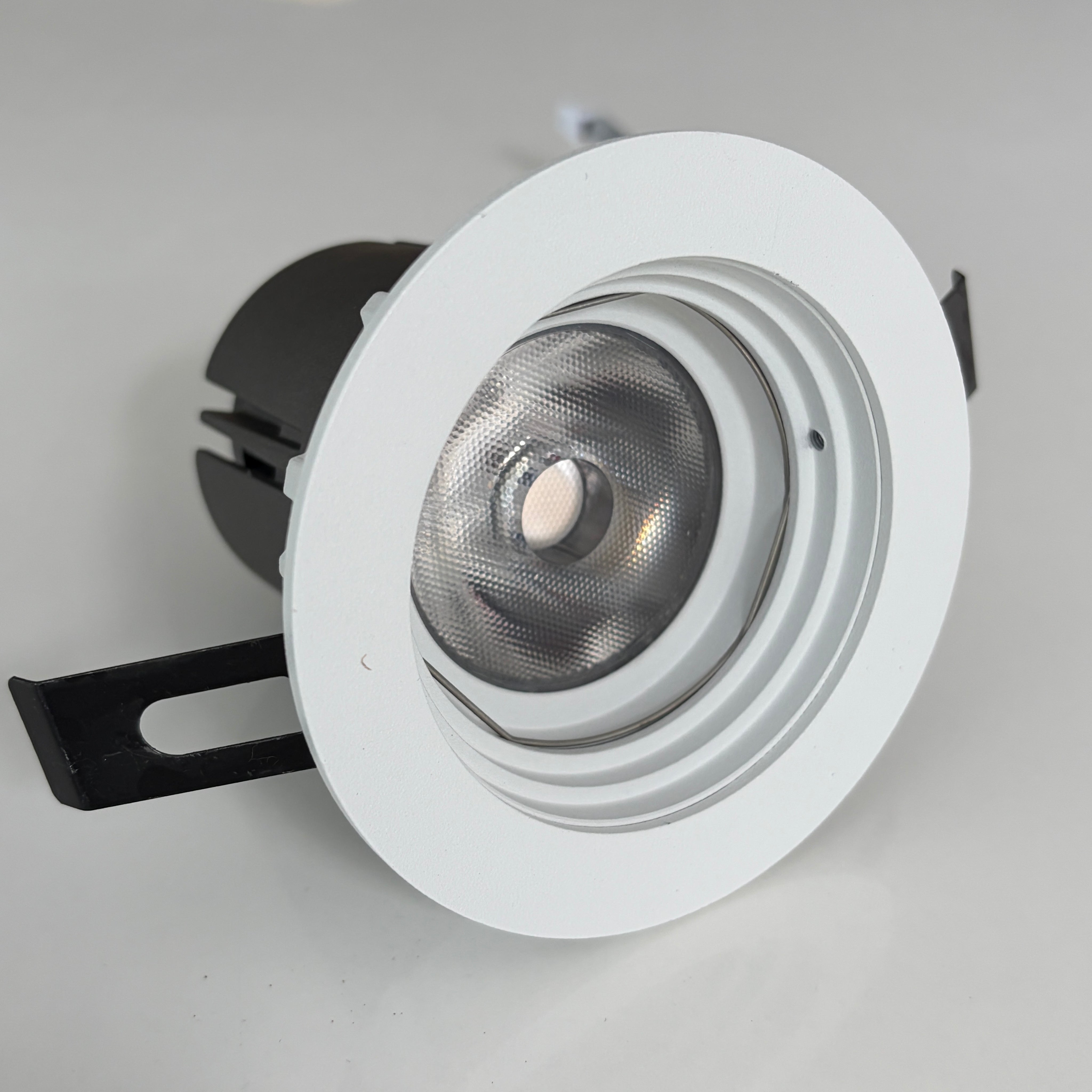 White recessed ceiling light on a gray background