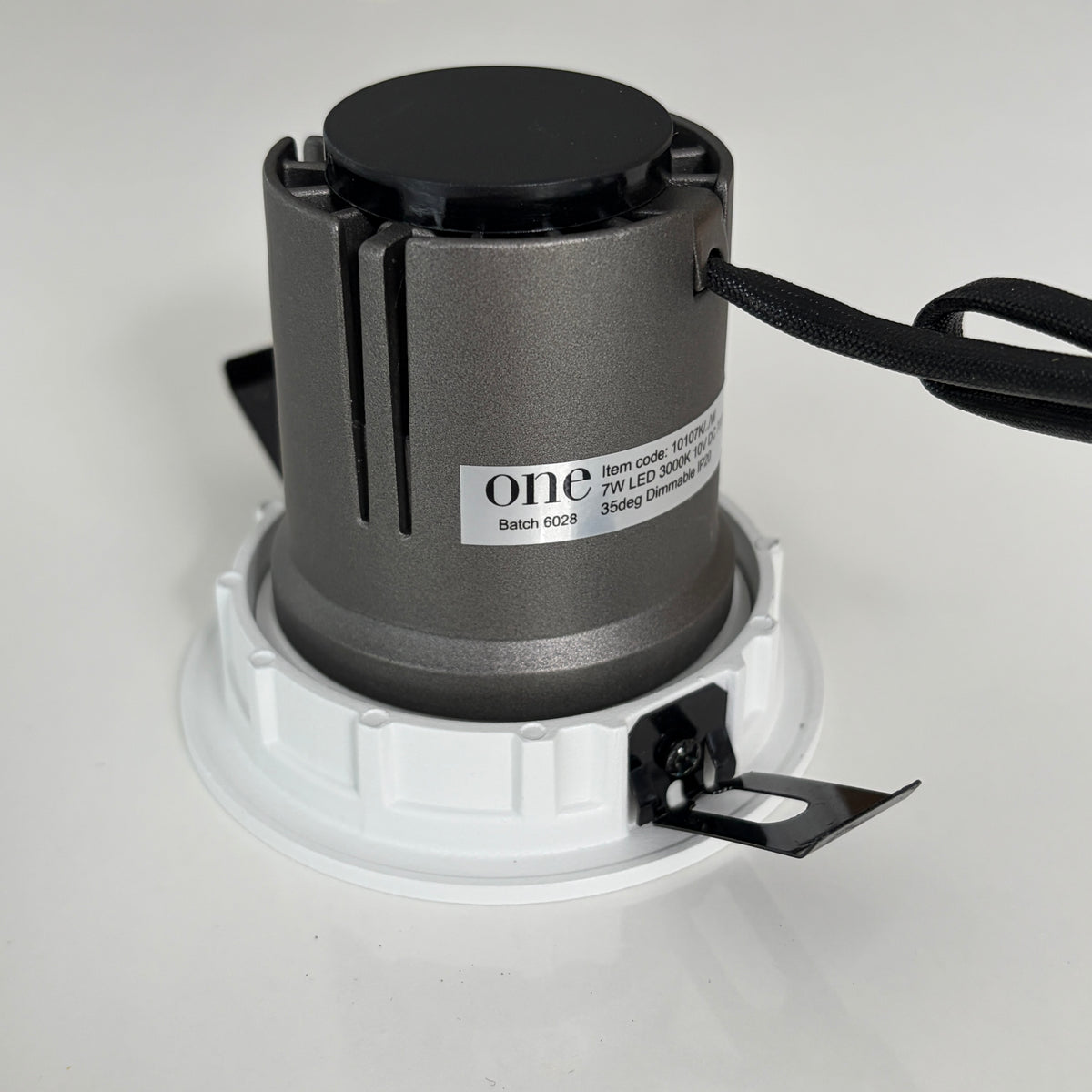 Light fixture with 'one' branding on a white background