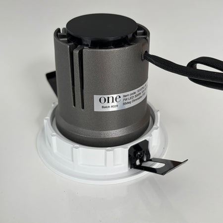 Light fixture with 'one' branding on a white background