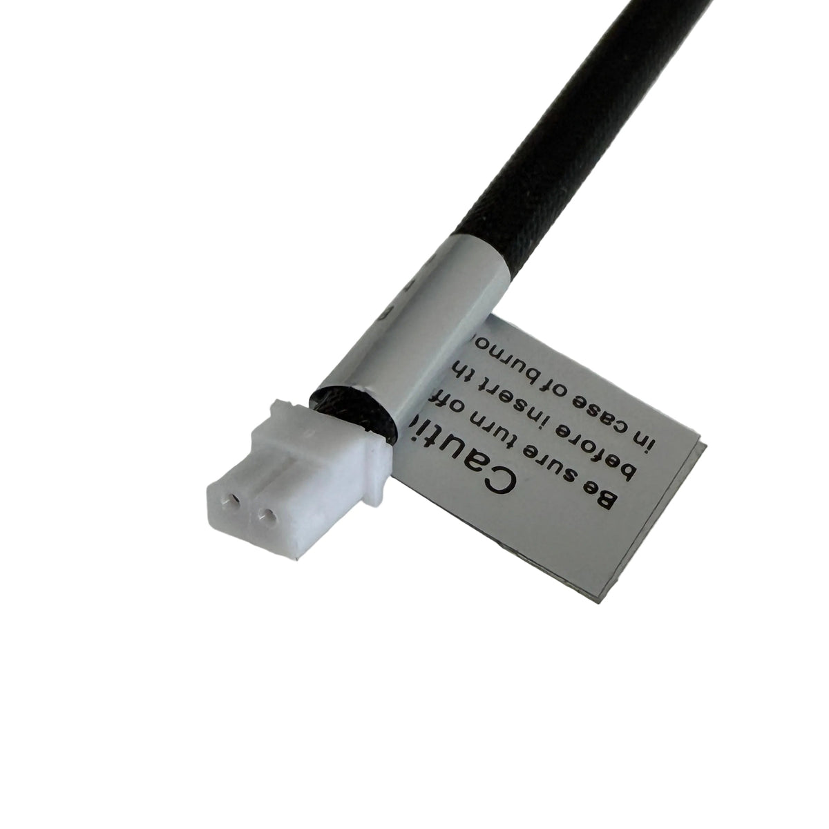 Black cable with a white connector on a gray background
