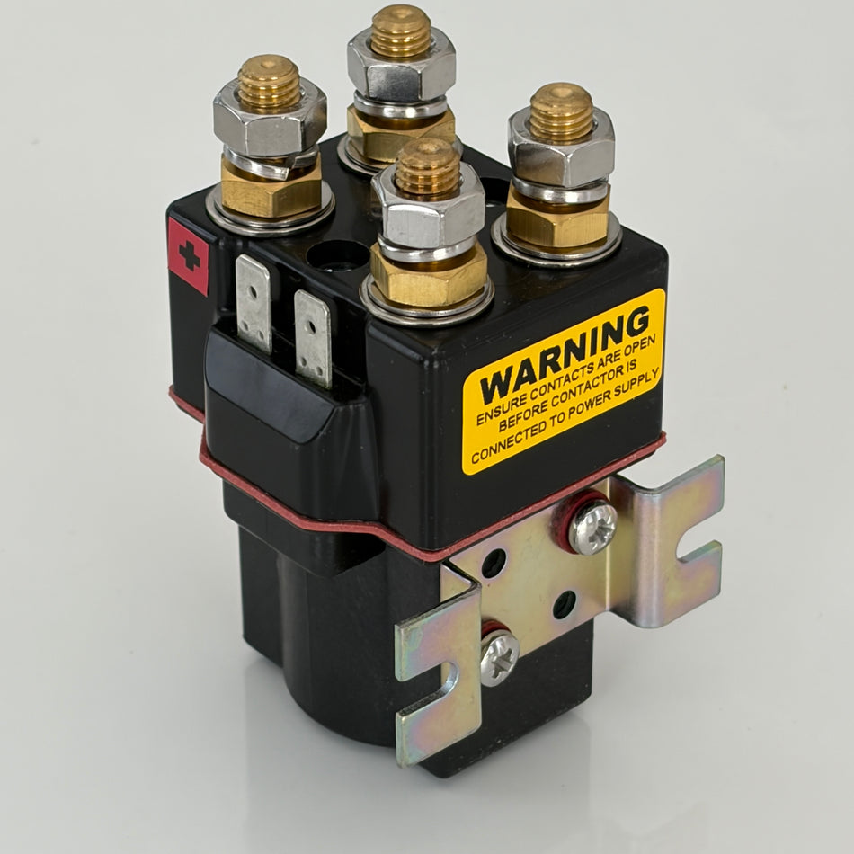Electrical relay with warning label on a gray background